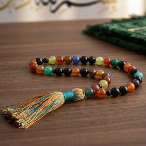 Aqeeq misbaha placed on prayer mat Islamic spiritual setting