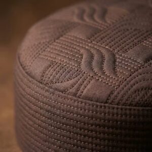 Close up texture of brown Islamic kufi cap premium stitching detail