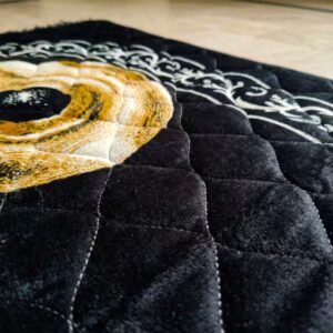 close up of black luxury full jumbo size prayer mat for adults