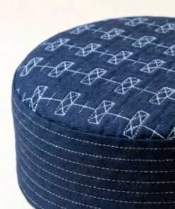 Close up texture of navy blue kufi cap premium stitching detail