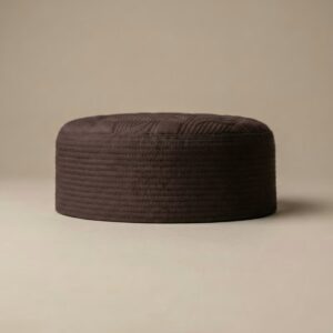 Side profile of brown Muslim namaz cap showing firm structured material