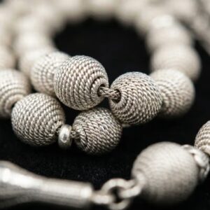 Close up of silver chandi coated tasbeeh beads shiny finish