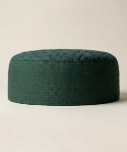 Side profile of green Islamic cap showing structured hard material