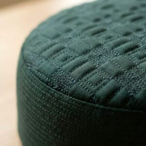 Close up texture of green Muslim namaz cap premium stitching detail