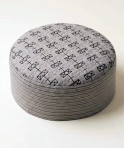 Top view of cream Muslim prayer cap with detailed self print pattern
