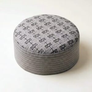 Top view of cream Muslim prayer cap with detailed self print pattern