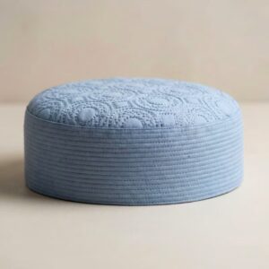 Side profile of light blue Islamic kufi cap showing hard structured material