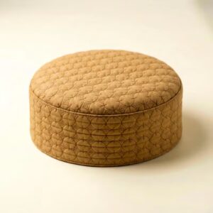 Top view of golden beige self print Muslim prayer cap with textured pattern