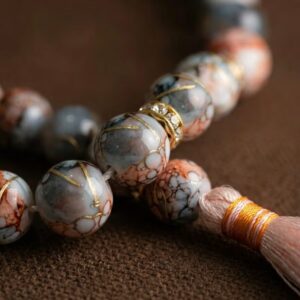 Close up of pink marble finish tasbeeh beads mixed color design