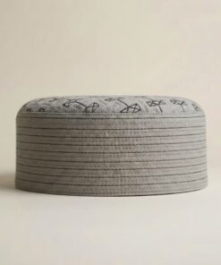 Side profile of cream Islamic kufi cap showing structured hard material