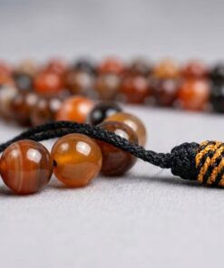 Close up of 6mm Aqeeq stone beads natural polished texture