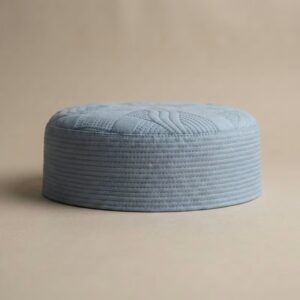 Side profile of sky blue Islamic kufi cap showing structured hard material